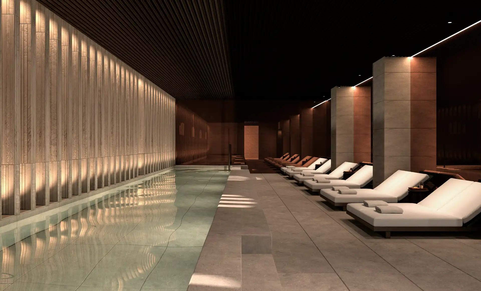 Indoor pool and loungers in the Kozmo Spa