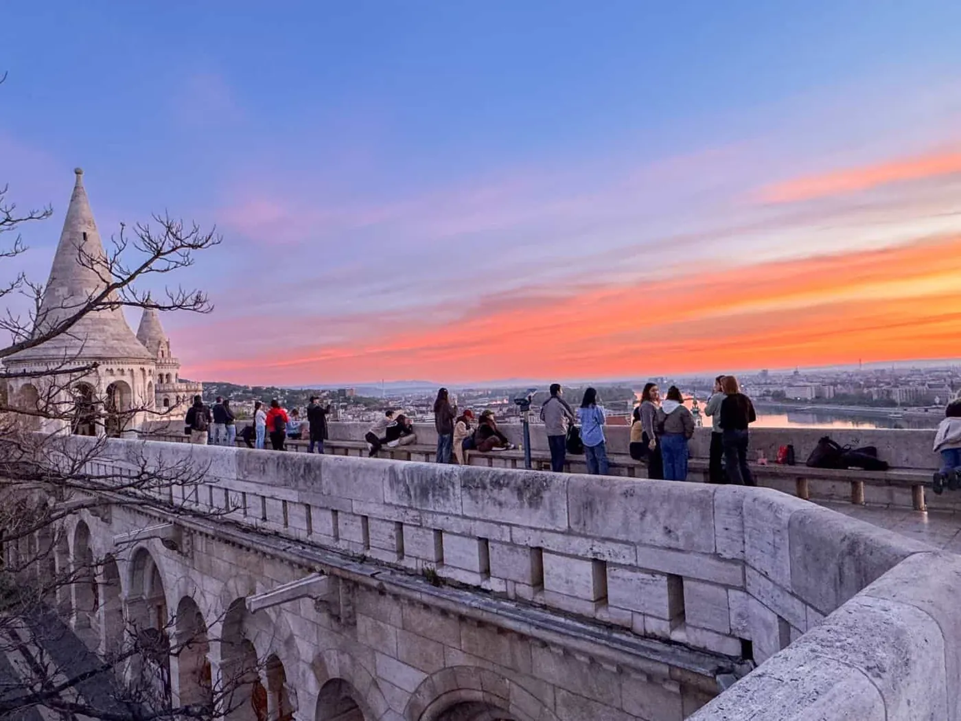 Dawn panorama from Fisherman's Bastion showing Parliament and the Danube in golden morning light